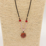 Collier cordon avec pendentif en pierre précieuse - Cornaline visage de soleil