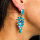 Boucles d'oreilles pendantes en verre vintage vert turquoise.