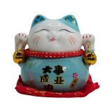 Tirelire chat en céramique - Bleue sur coussin