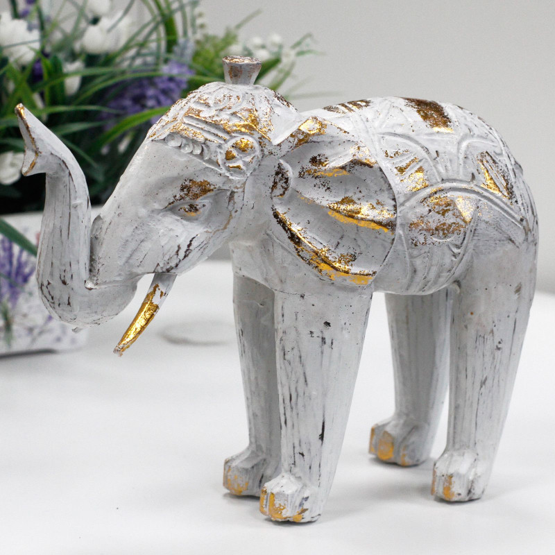 Éléphant sculpté en bois - Or blanc