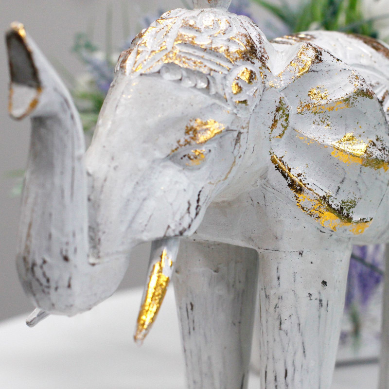 Éléphant sculpté en bois - Or blanc