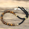 Bracelet en fil noir plaqué or 18 carats avec pierres précieuses - œil de tigre